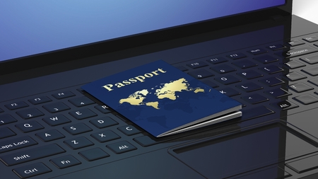 Passport on black laptop keyboardの写真素材