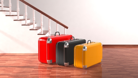 Suitcases beside stairs with white blank wall for copy-spaceの写真素材