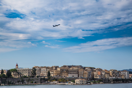 Corfu island cityscape from the sea with blue waters and sky.の写真素材