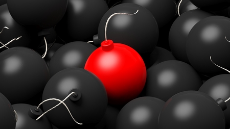 Close-up of red bomb lying on heap of black bombs.Illustrationの写真素材