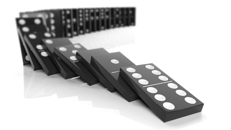 Black domino tiles falling in a row, isolated on whiteの写真素材