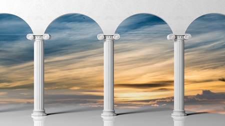 Three ancient pillars with sunset sky background.