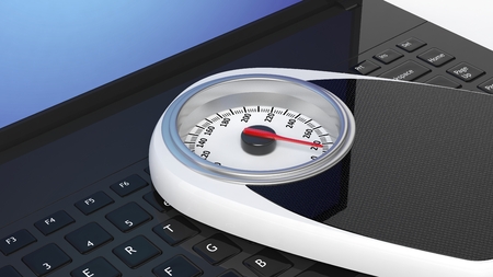 Bathroom scale on laptop keyboard