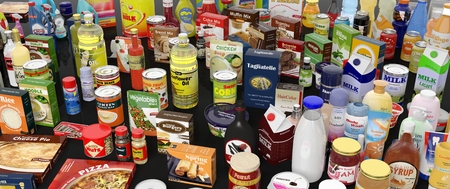 Various grocery products closeup, on black background with reflections