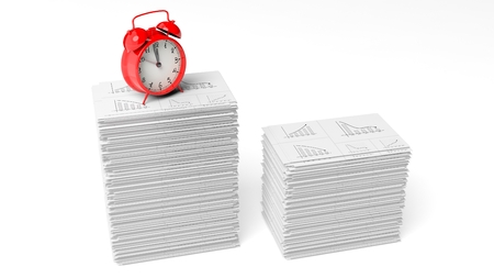 Red alarm cloack on a pile of paperwork with graphs, isolated on white background.の写真素材