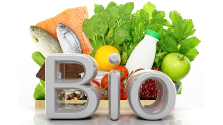 Grocery paper bag closeup with healthy products and Bio 3D word, isolated on whiteの写真素材