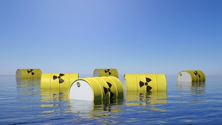 Yellow barrels for radioactive biohazard waste floating on sea surfaceの写真素材