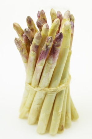 Bunch of fresh white asparagus, on white background.の写真素材