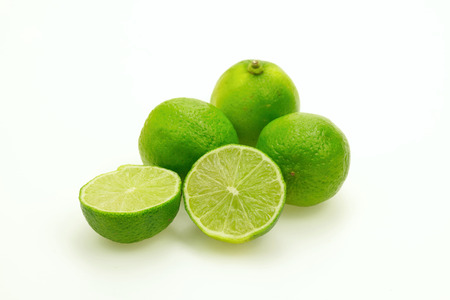 Several bright and fresh limes on white background.Isolated.