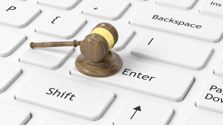 3D rendering of gavel on white keyboard