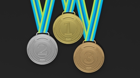 Close-up of 3D medals of silver,bronze and gold on black background.Isolated