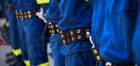 Rescuers wearing uniforms standing in deploymentの写真素材