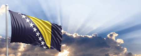 Bosnia and Herzegovina waving flag on blue sky. 3d illustrationの写真素材