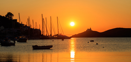 Greece, Kea island. Boats silhouette in the sea at sunset,の写真素材