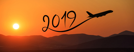 New year 2019 drawing by flying airplane on the air at sunrise, bannerの写真素材