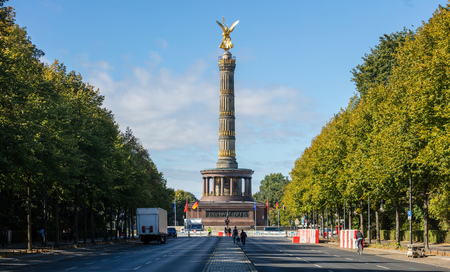 Berlin Victory Column. Golden statue of angel tries to touch the blue sky.の写真素材