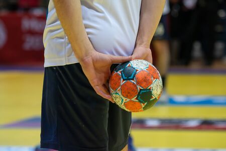 Ready for the match. Blurred referees, coaches and athletes and fieldの写真素材