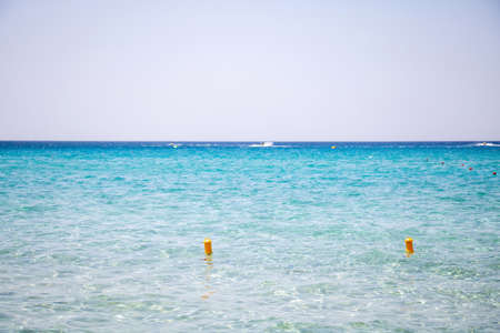 Calm sea empty sandy beach
