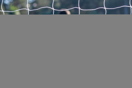 Football Soccer goalkeeper with color uniform and number one, from behind view.の写真素材