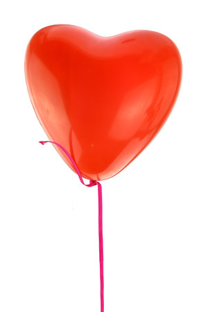 Red heart shape balloon and ribbon flying isolated on white background,の写真素材