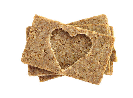 Multigrain bread slices stack and shape of heart cut isolated on transparent white backgroundの写真素材
