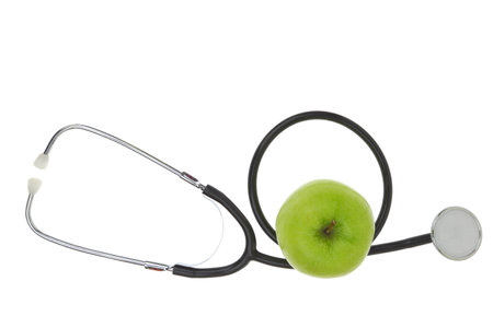 Green apple and medical stethoscope isolated on white transparent backgroundの写真素材