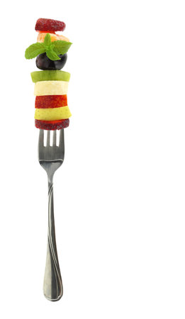 Healthy lifestyle, Fresh fruits slices and a fork isolated on white transparent backgroundの写真素材