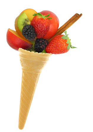 Fresh mixed fruits in an ice cream cone isolated on white transparent backgroundの写真素材