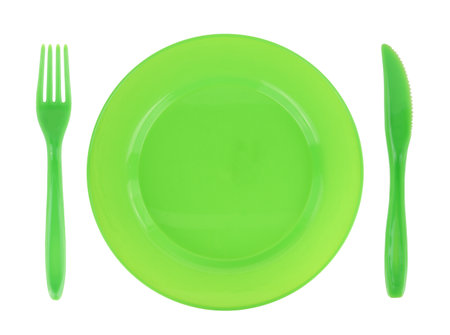 Green empty plate with fork and knife isolated on white transparent background, top viewの写真素材
