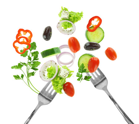 Fresh salad vegetables on a fork isolated on white transparent backgroundの写真素材