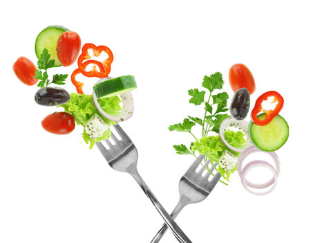 Fresh salad vegetables on a fork isolated on white transparent backgroundの写真素材