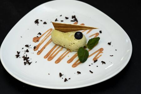 Pistachio cheesecake. green and soft pistachio souffle cake in a plate. green mini cheesecake with...