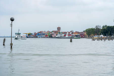 Burano, Venice, Italy - May 21, 2019: Colorful painted residential houses in Burano island, Venice, Italy. Burano street with Ñolorful facade building. Colorful architecture in Burano island.のeditorial素材