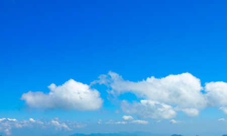 blue sky background with tiny clouds