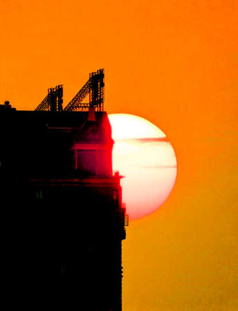 a cloudy sunset landscape with sunの写真素材