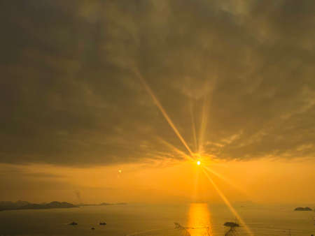 a cloudy sunset landscape with sun
