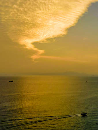 a cloudy sunset landscape with sun