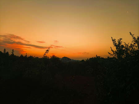 a cloudy sunset landscape with sunの写真素材