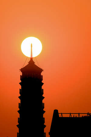 a cloudy sunset landscape with sunの写真素材