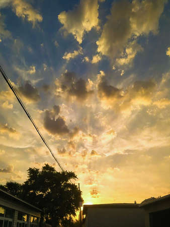 a cloudy sunset landscape with sun