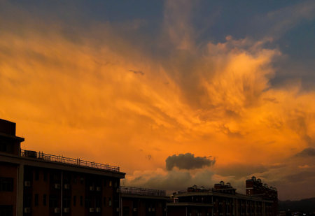 Beautiful cloudy sunset landscape with sunの写真素材