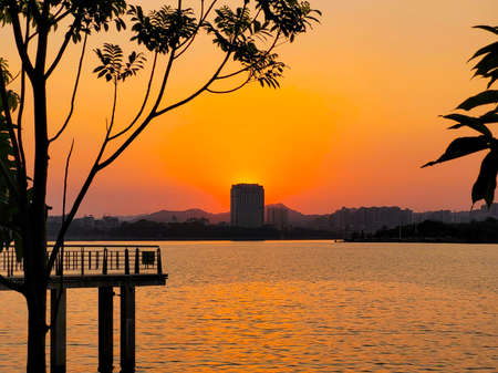 beautiful cloudy sunset landscape with sunの写真素材