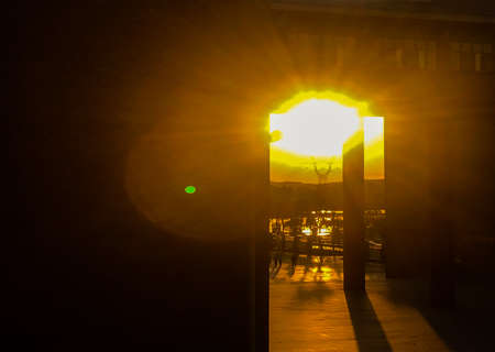 Beautiful cloudy sunset landscape with sunの写真素材