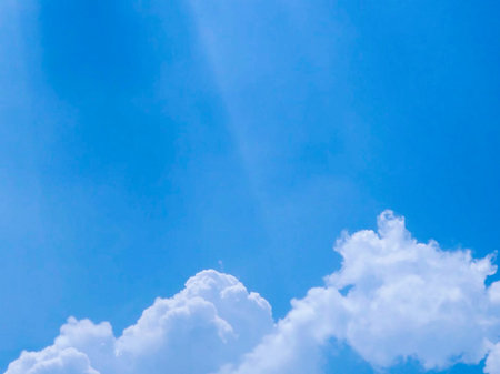 Beautiful blue sky background with tiny cloudsの写真素材