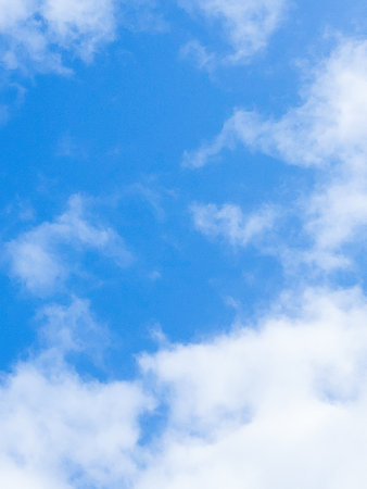Beautiful blue sky background with tiny cloudsの写真素材