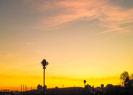 Beautiful cloudy sunset landscape with sun