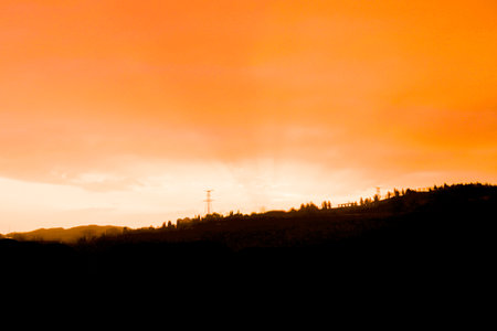 Beautiful cloudy sunset landscape with sunの写真素材