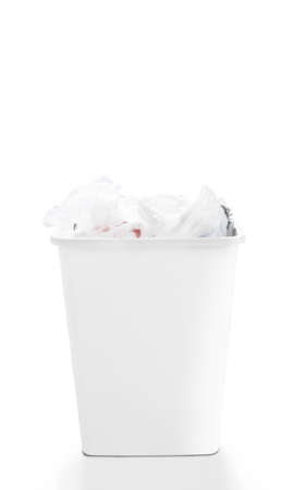 Loaded of clean shopping plastic bags in recycle bin on white background, cause effect of global warming. Concept of care and responsibility for reusable management, trash separation.の写真素材