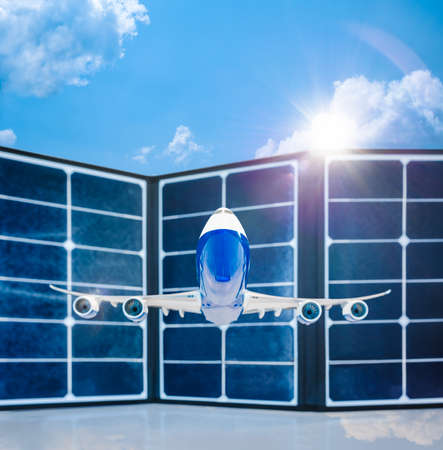 Commercial airplane fly beyond solar cells panel and sunlight in clouds blue sky background, depth...