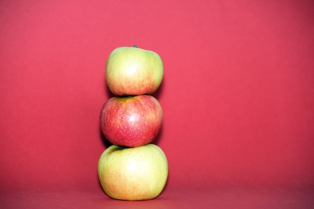 apples on a red backgroundの写真素材